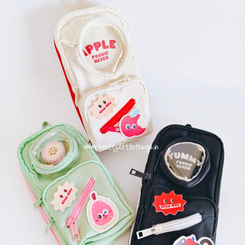 Three spacious multiutility pouches  with cartoon designs on a white background