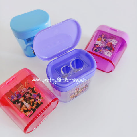 Five colorful k pop demon hunters theme plastic sharpeners with 2 holes and lid on a white background