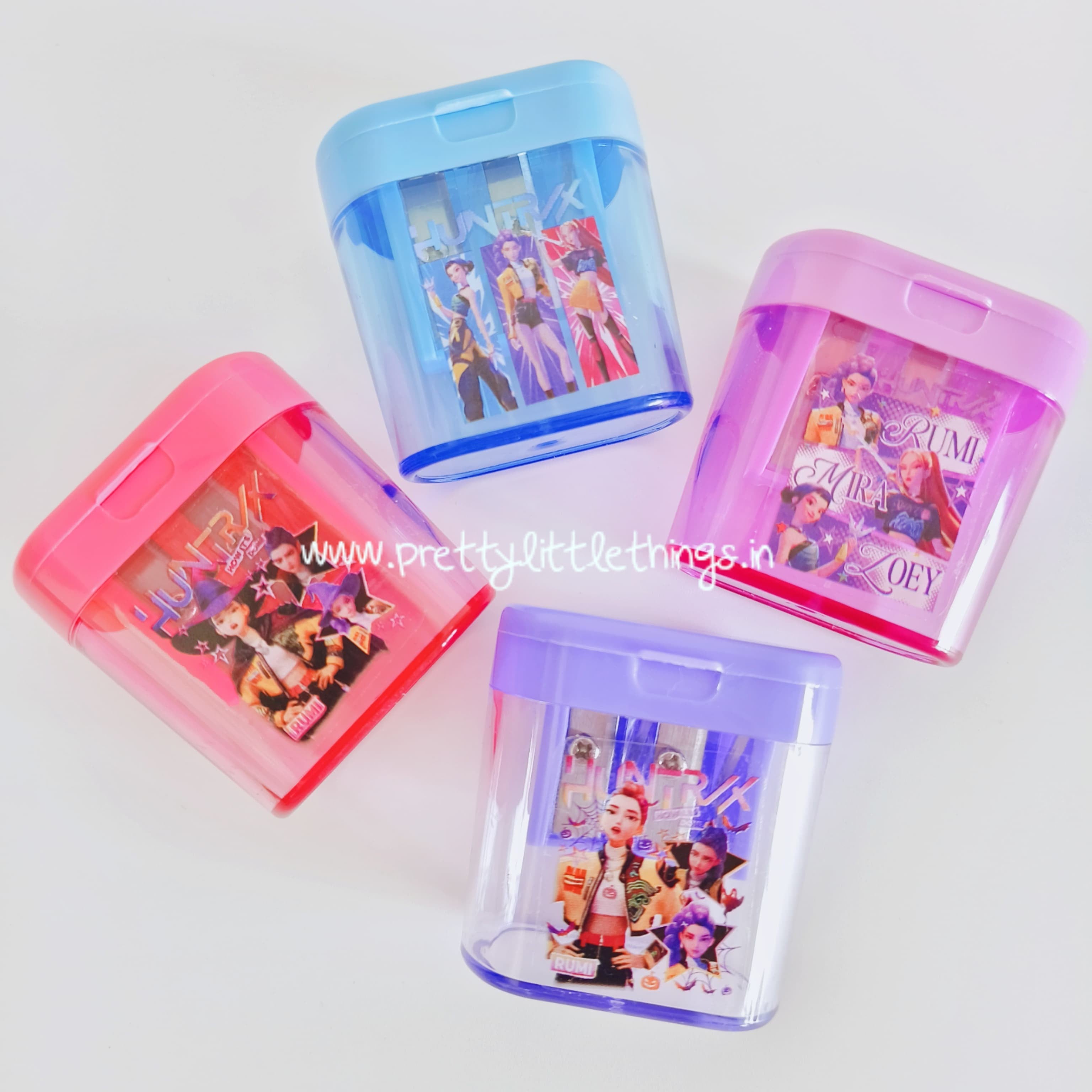 Four k pop demon hunter theme sharpeners with 2 holes on a white background. 