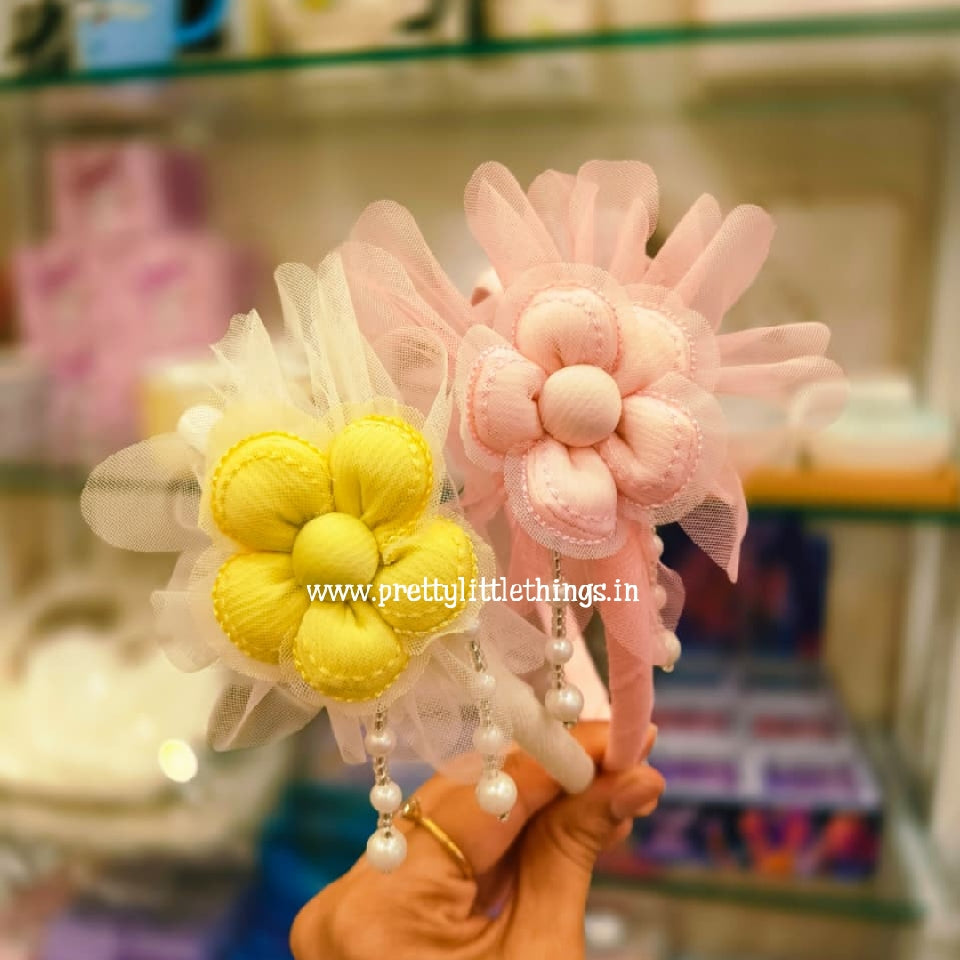 Decorative Fancy Colorful Slim Hair Band with Flower design at the top. Items in the image are yellow and pink color. 