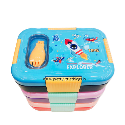 Colorful children's stainless steel lunch box with space-themed design on a white surface