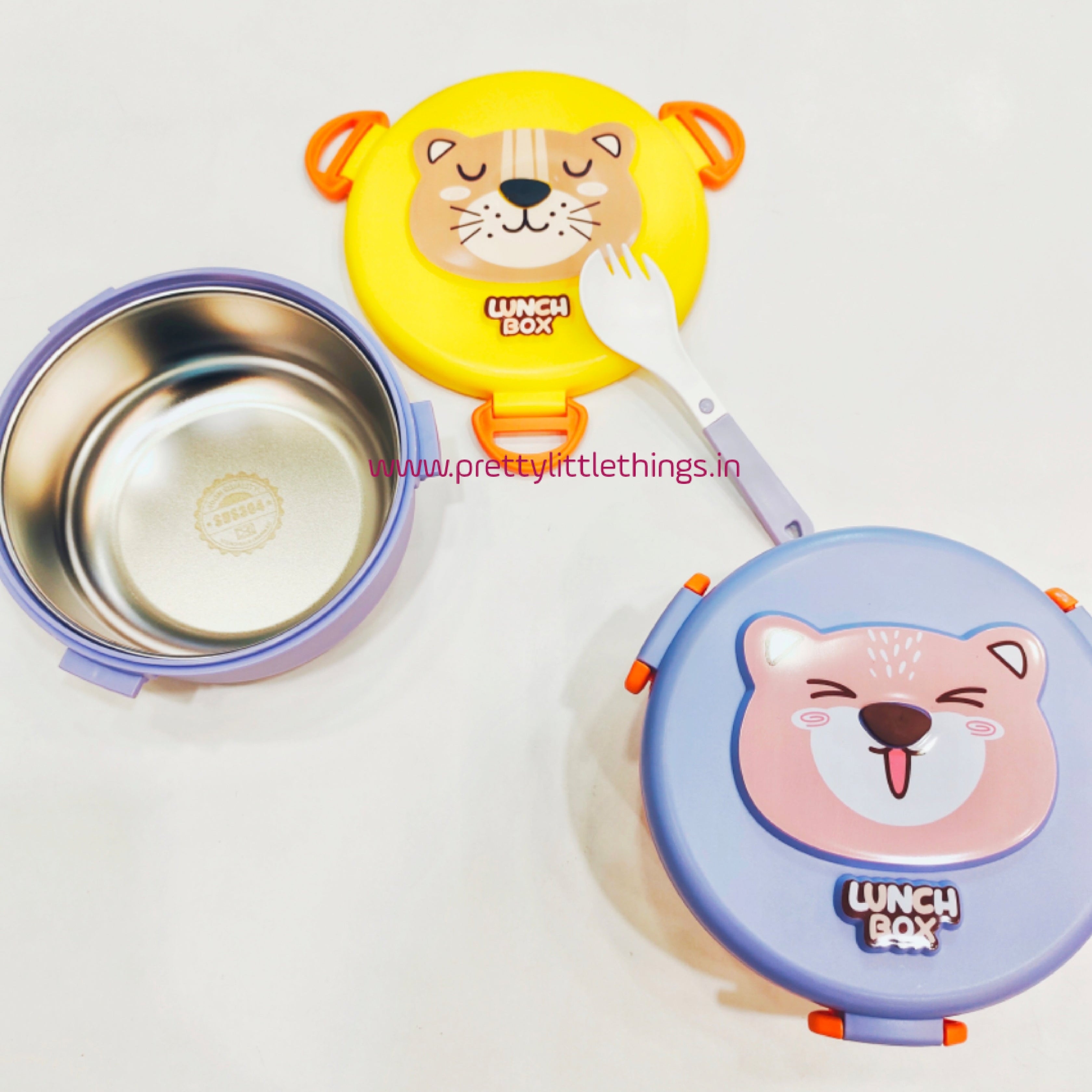 Two stainless steel lunch boxes with animal designs on lids, one yellow and one blue, on a white background.