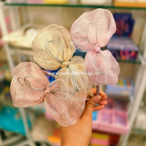 beautiful bows with shimmer stripes on slim hard hairbands. pink, creamish white and peachish pink colors.