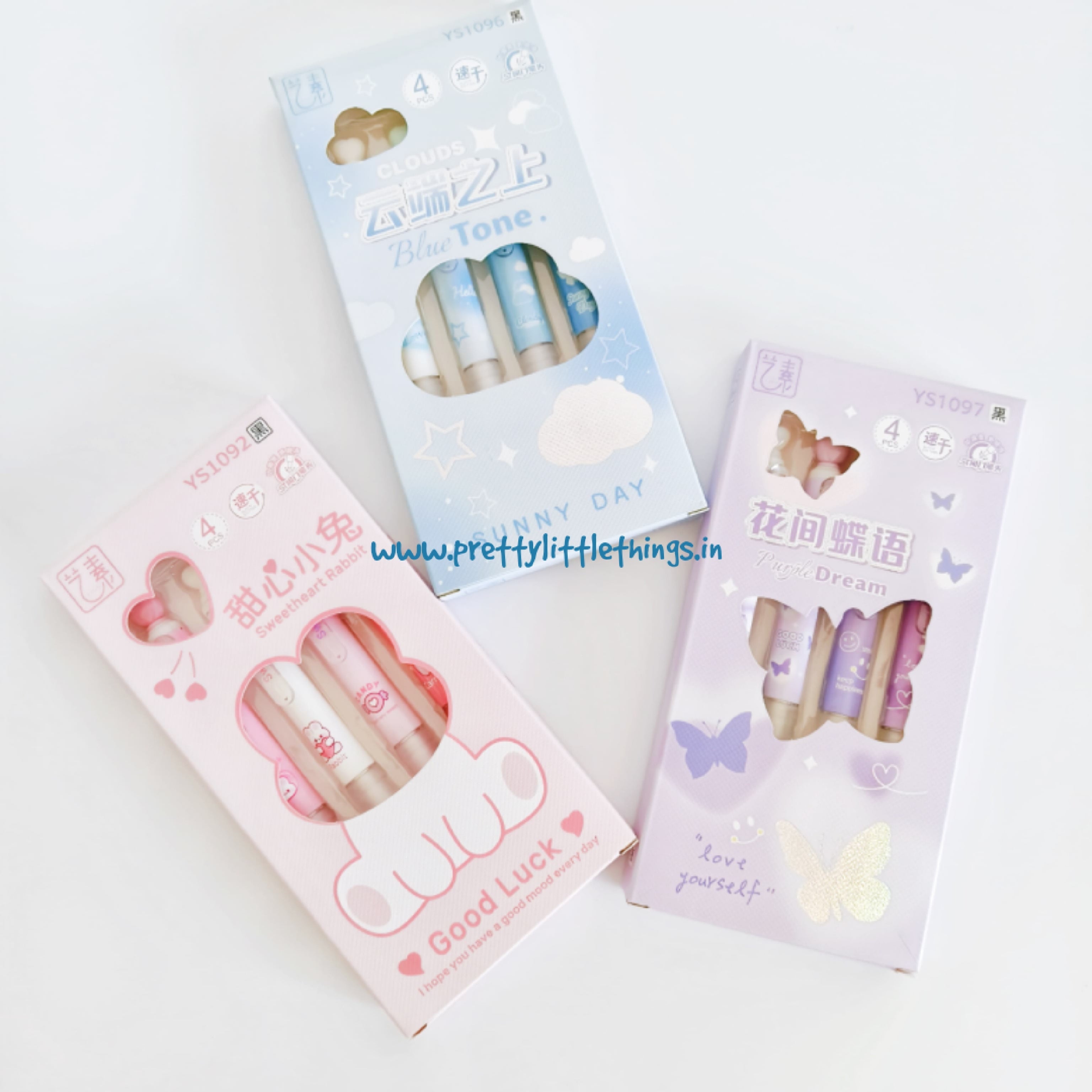 Three packs of pens with cute designs on a white background